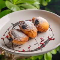 Black sesame stuffed doughnuts! Brought me back to my childhood of the crispy sweet exterior and the fluffiness of the dough inside! 🤤  at Replika in Dubai