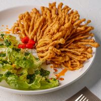 Something beyond different! Crispy enoki mushrooms I’m a gem lettuce wrap served with a spicy sweet chimichuri sauce!  at Replika in Dubai