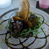 Grilled peach, lentil and argula salad at Replika in Dubai