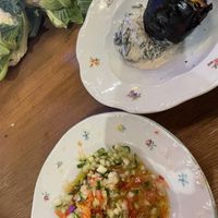 Blacked pumpkin with spinach & labneh cream; Jerusalem salad  at Goli Restaurant in Budapest