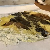 Smashed burn fire potatoes   at Goli Restaurant in Budapest