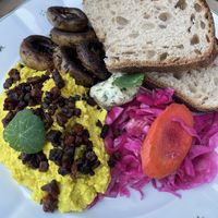 The scrambled tofu is tasty and it‘s a huge portion.  at Moment in Prague
