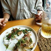 Shared a plate: pierogi left - langos right at Moment in Prague
