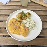 Fried cauliflower with celery in soyannaise and baked potatoes with spring onion  at Moment in Prague