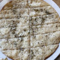 Vegan Garlic Fingers: vegan garlic sauce, vegan mozzarella & coconut donair sauce  at The Wooden Monkey in Halifax