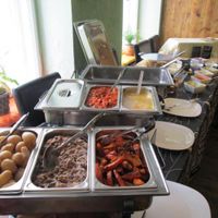 Sunday brunch, incl.: fake meat slices (seitan), German-style potato salad, a Mediterranean vegetable bolognese, a bean and mushroom casserole, potato soup, roasted pumpkin wedges, boiled potatoes, curry falafel and a pear and chocolate crumble. at Symbiose in Leipzig