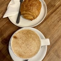 Banana bread latte with oat milk + vegan pain au chocolat   at XOKO in Inverness