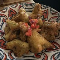 Battered and fried broccoli with spicy drizzle  at Shado Beni Caribbean Tapas Lounge in Caye Caulker