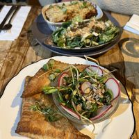 Lasagna bolognaise with wide cessation salad, spanikopita with side green salad   at Lola Rosa - Parc in Montreal