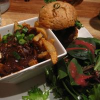 Cajun burger with a side salad. This is normally served with French fries, but you can transform your fries for a small vegan poutine for just a dollar or two. I really like this dish. at Lola Rosa - Parc in Montreal