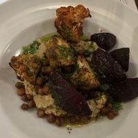 Cauliflower, beetroot, hummus, chickpeas  at HEVRE bar in Krakow