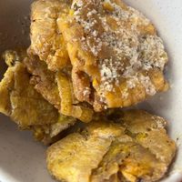 Tostones with garlic sauce and mojo. at Cafecito - South Loop in Chicago