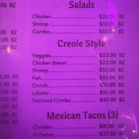 Creole style veggies is an option, comes in a spicy tomato broth  at Enjoy Lounge & Restaurant in Caye Caulker