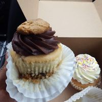 The raw cookie dough vegan cupcake and the happy birthday vanilla on the right at The Flying Cupcake in Indianapolis