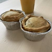 Empada (o suco pode ser comprado em outras barraquinhas do mercado)  at Mercado das Empadas in Porto