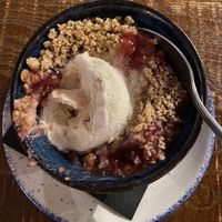 Apple and cherry crumble with vegan ice cream.   at Bell Inn in Shifnal