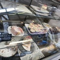 Fridge with pies: everything here is vegan. I tried the raspberry/lemon pie and the forest fruit cupcake: both had dry cakes but creamy and fluffy cream layers/toppings. They were too sweet for my taste. at Koek van Nouk in Arnhem