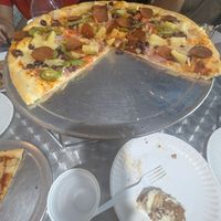 Part of a pizza someone else ordered - I believe it was vegan Greek but she added pineapple and vegan pepperoni at Midtown Pizza in Dallas