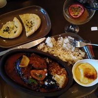 Roasted stuffed aubergine with pinenut rice & hummus & Garlic pitta 😋 at Lezzet in Scarborough
