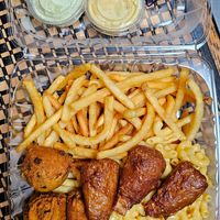 Fries, mac and cheese, vegan wings, and hush puppies at That Weird Place in Amarillo