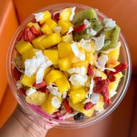 Goji Pitaya bowl, minus honey. Topped with mango, pineapple, kiwi, coconut flakes and goji berries. So freaking delicious! 😋  #Veganuary at Playa Bowls  in Dayton