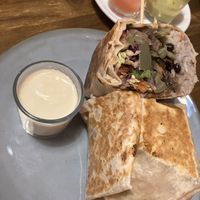 Vegan burrito with vegan cheese sauce   at La Patrona Calafell in Calafell