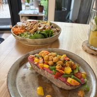 At the back the tofu Buddha bowl, and at the front the chickpea and roast veg on beetroot hummus, on toastt  at Daržo Dubuo in Vilnius