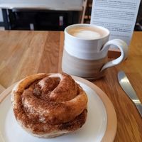 Vegan cinnamon swirl and decaf oat latte at Five Acres in St Andrews
