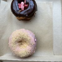 The top one is vegan chocolate covered strawberry and the bottom one is vegan cherry pie!  at Rose's Little Donuts in West Chester