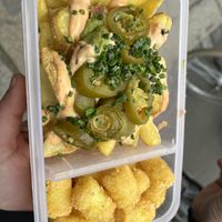 Guacamole loaded fries (top) and tater tots (bottom )  at Swing Kitchen in Leipzig