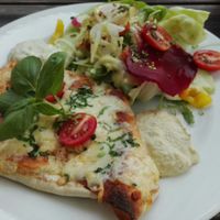 Filled tortilla with veggies and homemade dips at P'aa Restaurant Lounge in Linz