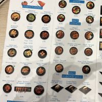 Green vegan symbol on vegan dishes  at Ikkan Sushi in London