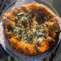 Pizza with broccolini, vegan mozzarella and vegan parmesan cheese .  at Lucky Penny in Santa Barbara