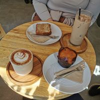 Vegan blueberry muffin and cappuccino and iced latte with oat milk. Banana bread was not vegan. at Simba Bru Coffee Roasters in Watford