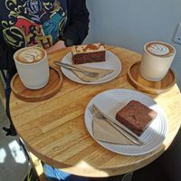 Toffee biscoff slice and 2 chai lattes with oatmilk. Brownie was not vegan. at Simba Bru Coffee Roasters in Watford