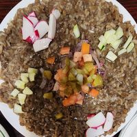 Mujaddar plate with extra veggies on top at Cedars Mediterranean Cuisine in Mcmurray