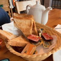Breakfast comes with tea and toast. Loads of jams, unfortunately only dairy butter available   at Manna Cafe & Bistro in Killarney