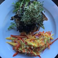 Blackened, marinated tofu served on rice, with a salsa of mango and red pepper. at Wild Leek in Halifax