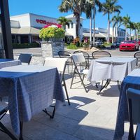 Outside and inside seating at Em-On's Thai Cafe in Naples