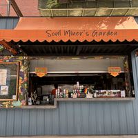 Super cute food stall with plenty of seating   at Soul Miner's Garden  in Charlotte