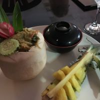 Green curry in a coconut with fresh pineapple to cool the heat of the spice ... awesome! at Thai Spice in Corpus Christi