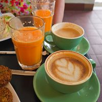 Vitamin C Booster juice and coffee with oatmilk at Mom's Bakery in Bandung