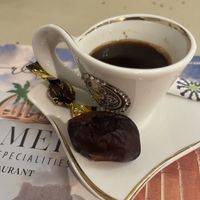 Arabian coffee with a date on the side  at  Palmera Restaurant in Winterthur