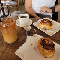 Iced oat americano, americano and cinnamon bun   at Oats Day Long   in Brussels