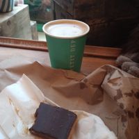 Cappuccino with oat milk, vegan twix pastry at Le Petit Dep  in Montreal