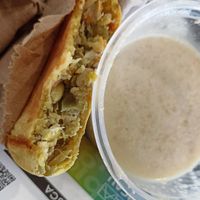 Empanada de vegetales y avena con leche de coco 🤍 at Delicias  Naturales in Bucaramanga