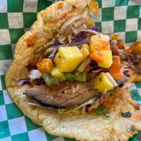 Half eaten fish taco at El Cantaro Vegan Mexican Restaurant in Monterey