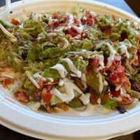 Half eaten Veggie Supreme burrito at El Cantaro Vegan Mexican Restaurant in Monterey