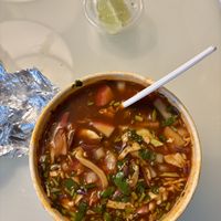 Pozole soup with TONS of onion and LOTS of salt. Only able to had a few sips. ☹️Think twice before ordering.   at El Cantaro Vegan Mexican Restaurant in Monterey