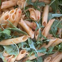 Chickpea penne pasta 
With fresh basil and arugula
In a garlic eggplant sauce   at Suka Kitchen Culebra  in Culebra